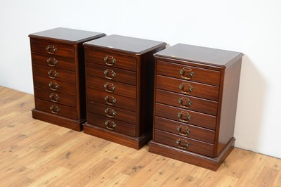 Lot 11 - A set of three reproduction mahogany music cabinets