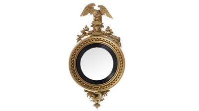 Lot 1308 - A large and decorative Regency gold painted and gesso mirror.