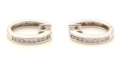 Lot 800 - A pair of diamond earrings