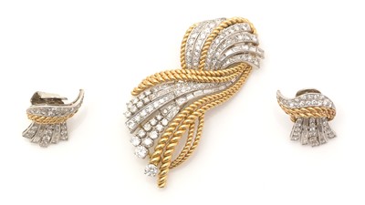 Lot 809 - A gold and diamond brooch and matching earrings