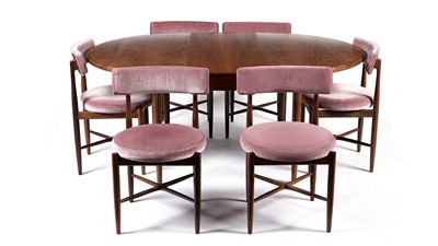 Lot 10 - A retro teak extending dining table and chairs