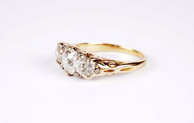 Lot 1129 - A Victorian three stone old-cut diamond ring
