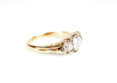 Lot 1129 - A Victorian three stone old-cut diamond ring