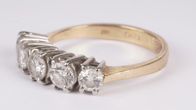 Lot 1131 - A five stone diamond ring