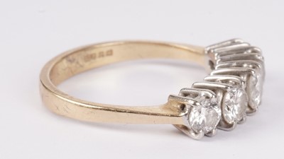 Lot 1131 - A five stone diamond ring