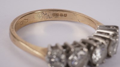 Lot 1131 - A five stone diamond ring