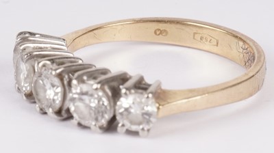 Lot 1131 - A five stone diamond ring