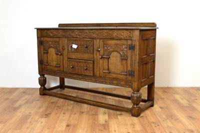 Lot 18 - Siesta by N.H Chapman of Newcastle upon Tyne: A Jacobean Revival oak sideboard