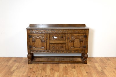 Lot 18 - Siesta by N.H Chapman of Newcastle upon Tyne: A Jacobean Revival oak sideboard