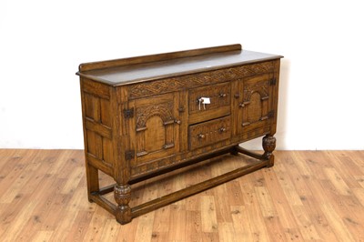 Lot 18 - Siesta by N.H Chapman of Newcastle upon Tyne: A Jacobean Revival oak sideboard