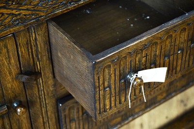 Lot 18 - Siesta by N.H Chapman of Newcastle upon Tyne: A Jacobean Revival oak sideboard