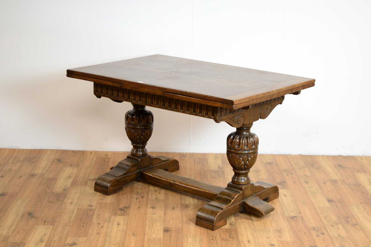 Lot 77 - Siesta by N.H Chapman of Newcastle upon Tyne: A 20th Century Jacobean Revival oak dining table