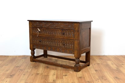 Lot 10 - Siesta by N.H Chapman of Newcastle upon Tyne - A 20th Century Jacobean Revival oak sideboard