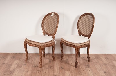 Lot 54 - A set of eight stylish modern hardwood 'faux rope' dining chairs