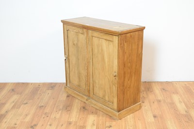 Lot 17 - A 20th Century stripped pine cupboard