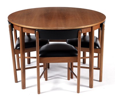Lot 65 - McIntosh of Kirkaldy: A retro teak extending dining table and chairs