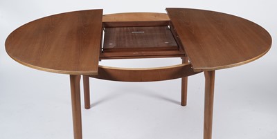 Lot 65 - McIntosh of Kirkaldy: A retro teak extending dining table and chairs
