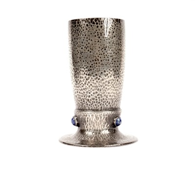 Lot 184 - An English Pewter by Liberty & Co hammered pewter vase