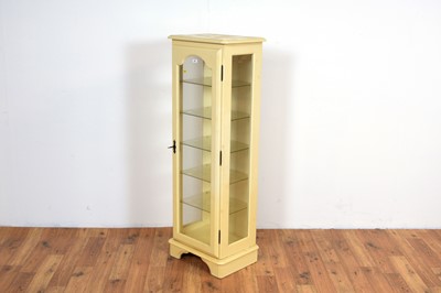 Lot 44 - A contemporary glazed display cabinet of upright form