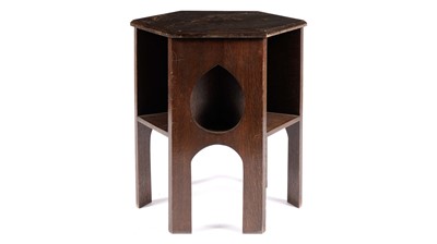 Lot 998 - An early 20th Century Arts and Crafts oak table/bookcase, in the manner of Liberty & Co