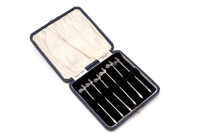 Lot 477 - A set of six silver cocktail sticks