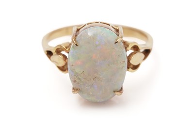 Lot 435 - An opal cabochon dress ring