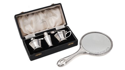 Lot 161 - An Art Deco revival 3-piece silver condiment set and an Art Nouveau silver hand mirror