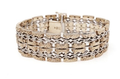 Lot 402 - A 9ct yellow and white gold bracelet