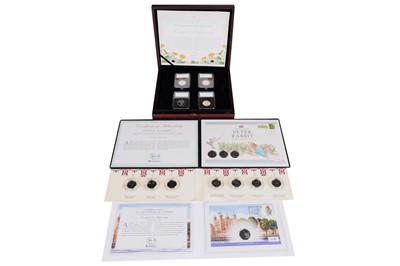 Lot 393 - A collection of stamps and coin sets
