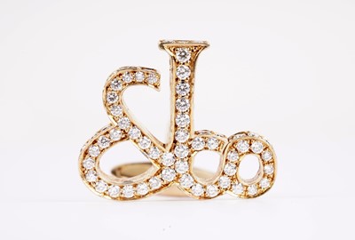 Lot 1134 - Jacob & Co, New York: a pair of diamond-set yellow gold monogram pattern cufflinks