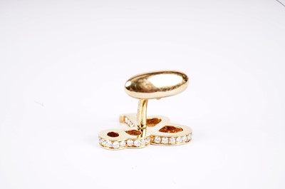 Lot 1134 - Jacob & Co, New York: a pair of diamond-set yellow gold monogram pattern cufflinks