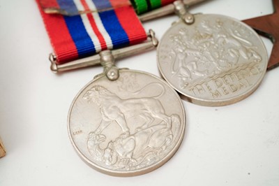 Lot 1018 - Omega British Military: A stainless steel cased manual wind wristwatch and medals