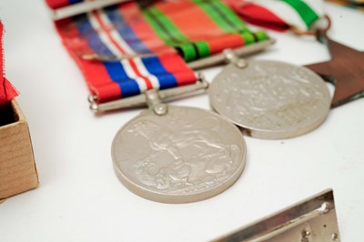Lot 1018 - Omega British Military: A stainless steel cased manual wind wristwatch and medals