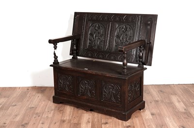 Lot 88 - An early 20th Century oak monk's bench