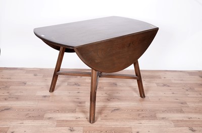 Lot 48 - A Ercol Windsor table and six Goldsmith's chairs