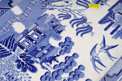 Lot 300 - A set of eleven ‘Willow’ pattern graduated meat and serving plates