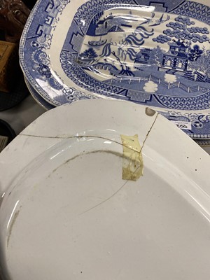 Lot 300 - A set of eleven ‘Willow’ pattern graduated meat and serving plates
