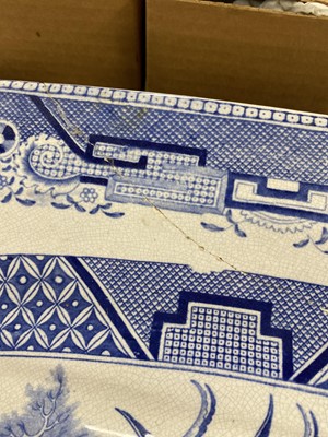 Lot 300 - A set of eleven ‘Willow’ pattern graduated meat and serving plates