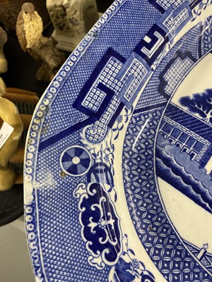 Lot 300 - A set of eleven ‘Willow’ pattern graduated meat and serving plates
