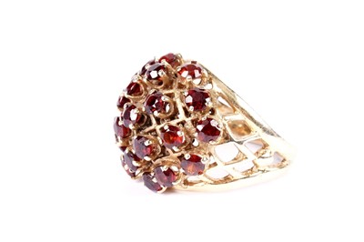 Lot 584 - A garnet cluster dress ring
