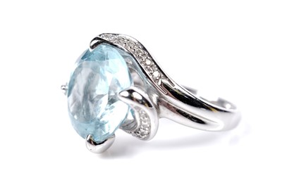 Lot 1138 - A topaz and diamond cocktail ring