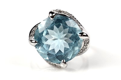 Lot 1138 - A topaz and diamond cocktail ring