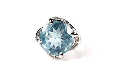 Lot 1138 - A topaz and diamond cocktail ring