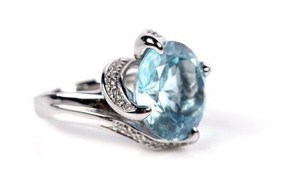 Lot 1138 - A topaz and diamond cocktail ring