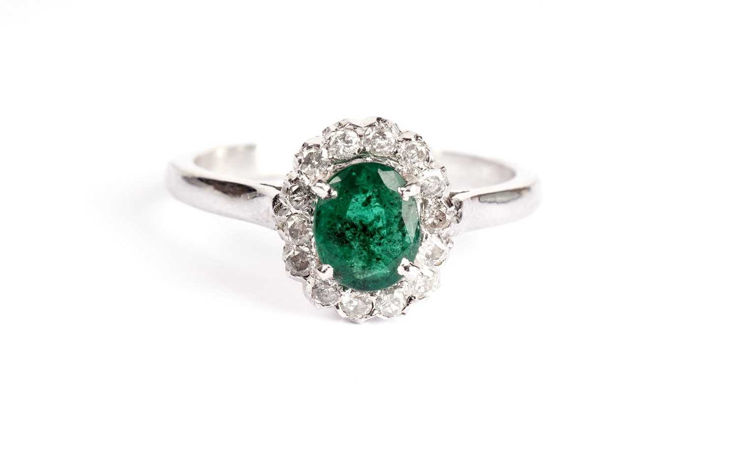 Lot 361 - An emerald and diamond cluster ring