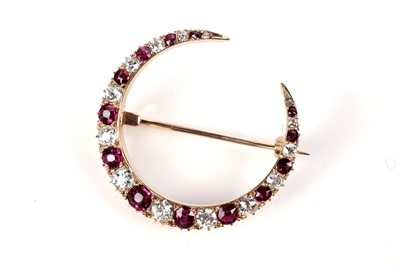 Lot 1172 - A ruby and diamond crescent brooch