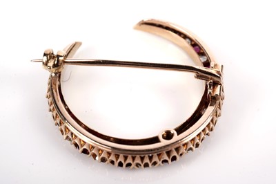 Lot 1172 - A ruby and diamond crescent brooch