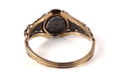 Lot 1125 - A Victorian ruby and seed pearl mourning ring