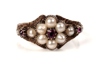 Lot 1125 - A Victorian ruby and seed pearl mourning ring