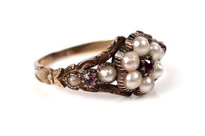 Lot 1125 - A Victorian ruby and seed pearl mourning ring